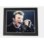 David Bowie / Autograph: A 10"x8" photo boldly signed by David Bowie with COA As per our Terms and