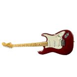 Electric Guitar: An L Series Fender Stratocaster guitar, finished in Dakota Red, the neck with the