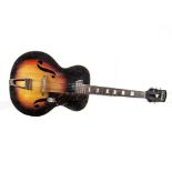 Acoustic Guitar: A Harmony Monterey vintage archtop finished in Sunburst with wooden tail piece,