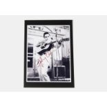 Johnny Cash / Autograph: A 10"x8" photo boldly signed by Johnny Cash with COA As per our Terms and