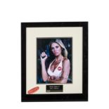 James Bond / Britt Ekland Autograph: Framed and glazed colour print signed Britt Ekland, with UACC