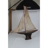 A late 19thC Pond Yacht c1890s: Gaff-rigged of wooden construction with lead-weighted balanced keel,