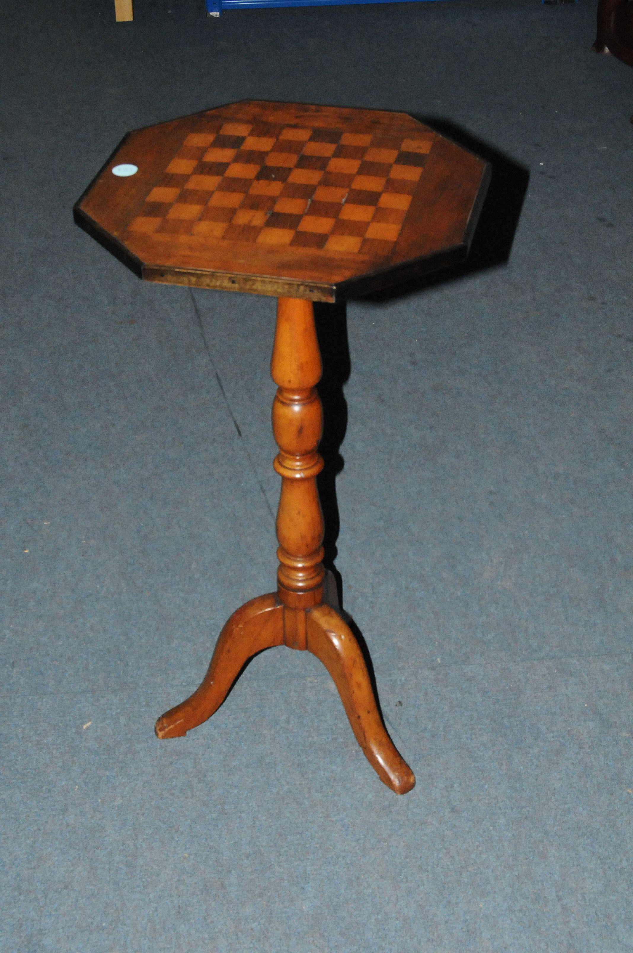 A 19th century and later pedestal occasional table, having octagonal chess board inlaid top on