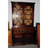 A Victorian mahogany secretaire bookcase, with coloured lights, the fitted section with maple draw