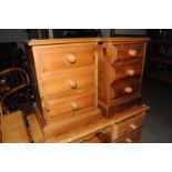 A pair of pine three drawer bedside chests, on plinth base 63cm H