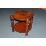 An Art Deco period African hardwood occasional table, having four elephant head, trunk and foot