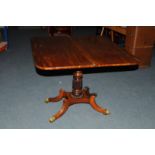 A William IV or early Victorian mahogany card table, on pedestal base with four supports and