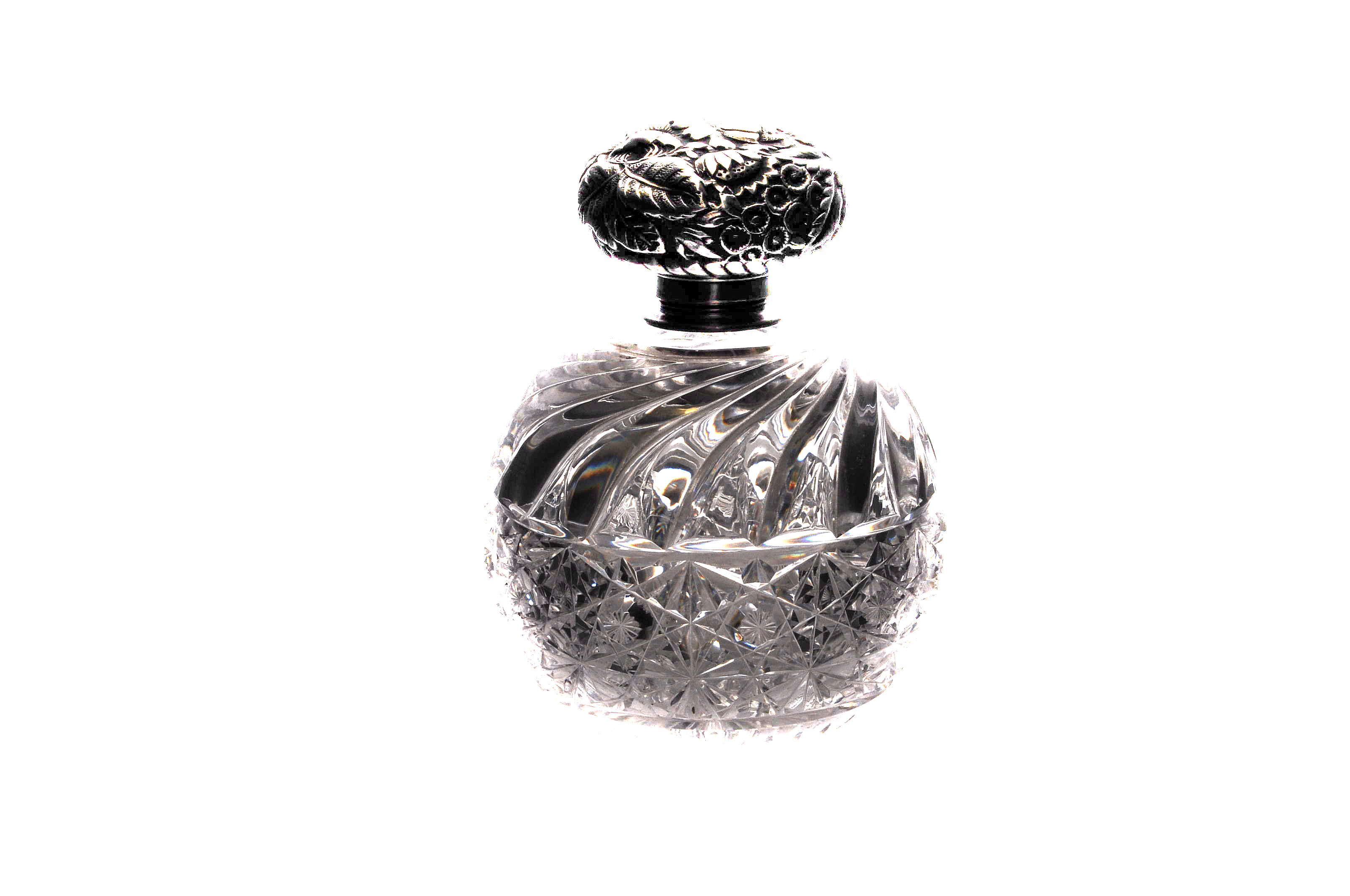 An Art Deco period cut glass and silver mounted perfume bottle, the spherical hob nail and swirl