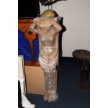 A pair of 19th century carved wooden caryatids, modelled as male and female, originally to support a