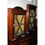 An Edwardian mahogany floor standing corner cabinet, adapted as two hanging wall cabinets, with