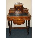 A rosewood inlaid work table, fitted with frieze and lower drop compartment, the top with raised