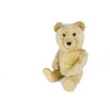 A Chiltern Ting - a - Ling Teddy Bear, 1950s, with golden mohair, orange and black glass eyes, inset