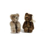 Two Schuco miniature Teddy Bears, 1950s, one brown and one beige mohair, both with metal pin eyes,