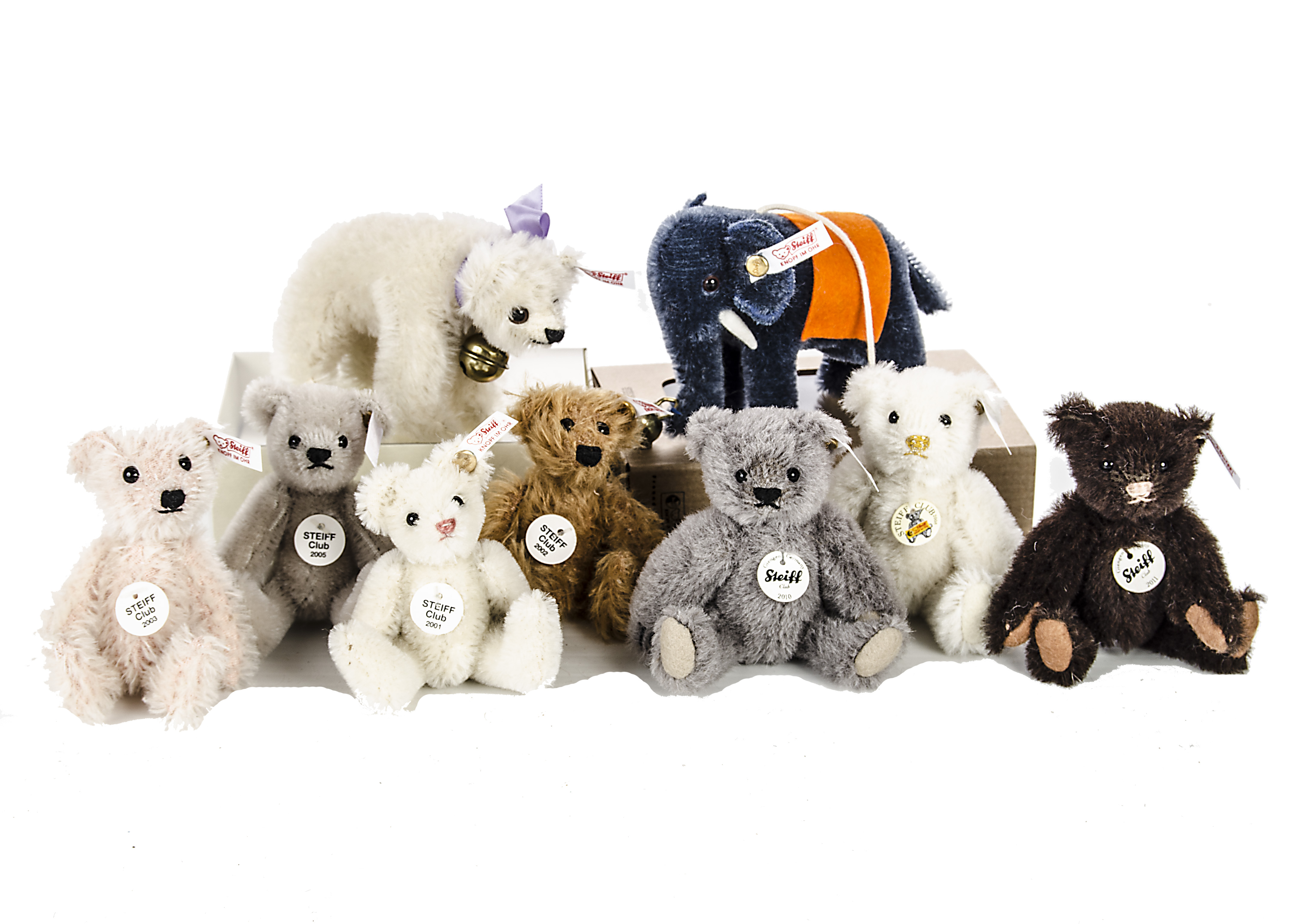 Ten Steiff Club Gift miniature Teddy Bears 2001 to 2011, one an elephant and one a crib bear, in