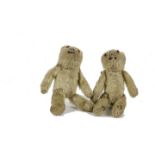 A pair of Farnell ‘soldier’ Teddy Bears, 1st World War, with golden mohair, orange and black glass