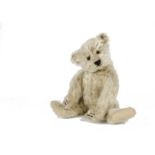 A rare Steiff Teddy Clown, circa 1926, with pale yellow mohair, brown and black glass eyes,