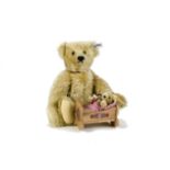 A Steiff Limited Edition Giengen Teddy Bear Set, 1080 of 16000, with baby in cradle, in original