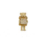 A Hertwig all - bisque girl Teddy Bear, 1910-20s, with pin - joints and yellow crochet dress - 1¾in.