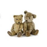 Two post - war Chiltern Teddy Bears: a blonde Hugmee with orange and black glass eyes, black