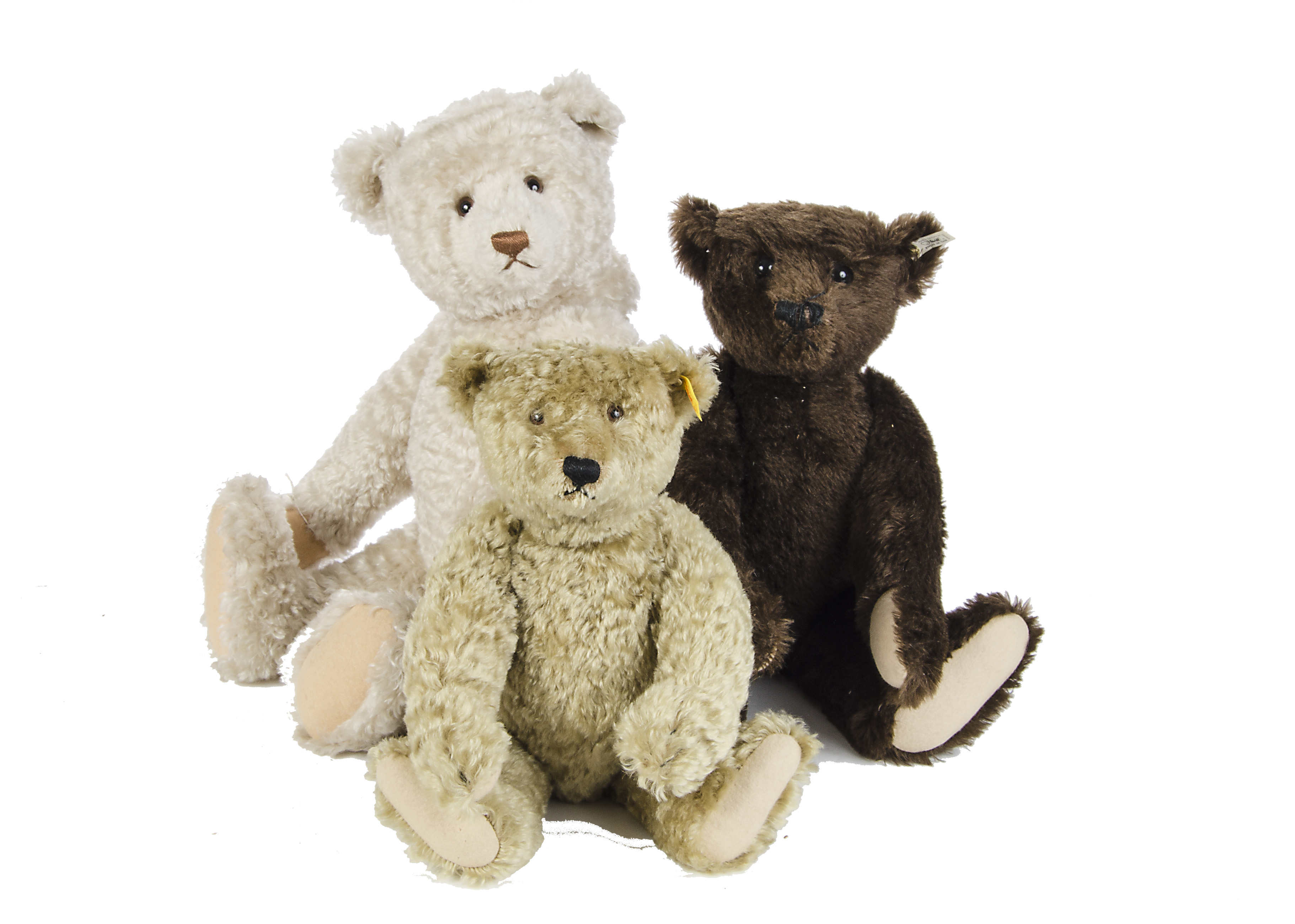 A Steiff British Collector’s 1907 brown Teddy Bear, 1334 of 3000, 1993; and large white Teddy Bear