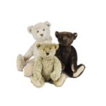 A Steiff British Collector’s 1907 brown Teddy Bear, 1334 of 3000, 1993; and large white Teddy Bear