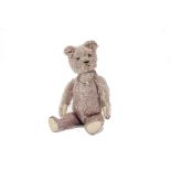 A German frosted lilac mohair Teddy Bear, 1930s, with clear and black glass eyes with brown