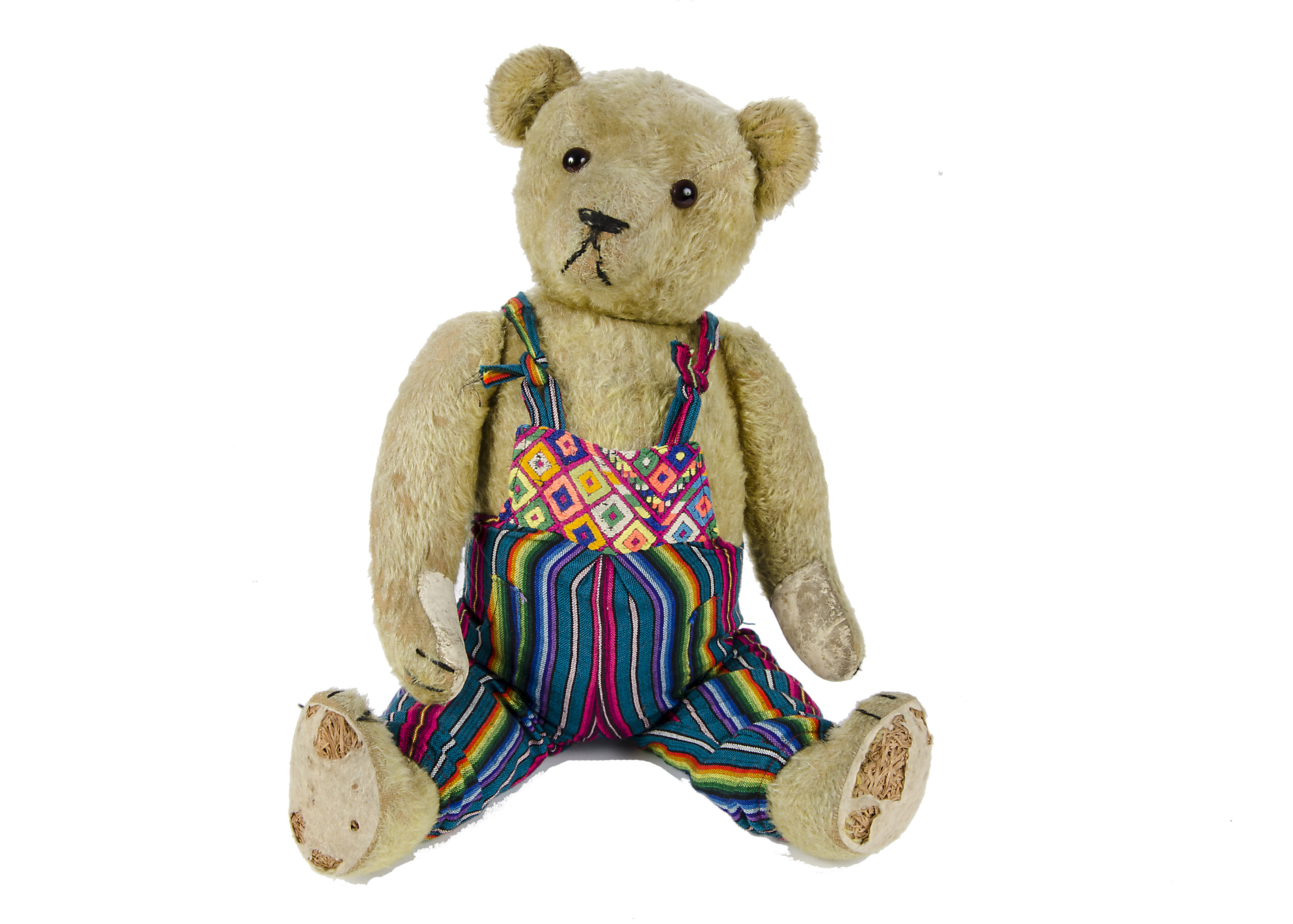 A German Teddy Bear, 1930s, with golden mohair, orange and black glass eyes, pronounced muzzle,