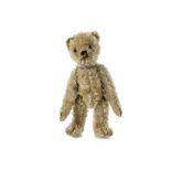 A rare early Bing Teddy Bear, circa 1908, with golden mohair, black boot button eyes, back of head