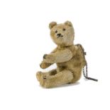 A rare British Teddy Bear purse, 1920s, with dark blonde mohair, black tin eyes, slotted - in ear,