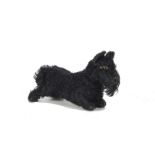 A 1930s Steiff standing Scotty Dog, with black mohair, brown, black and white elliptical eyes, black