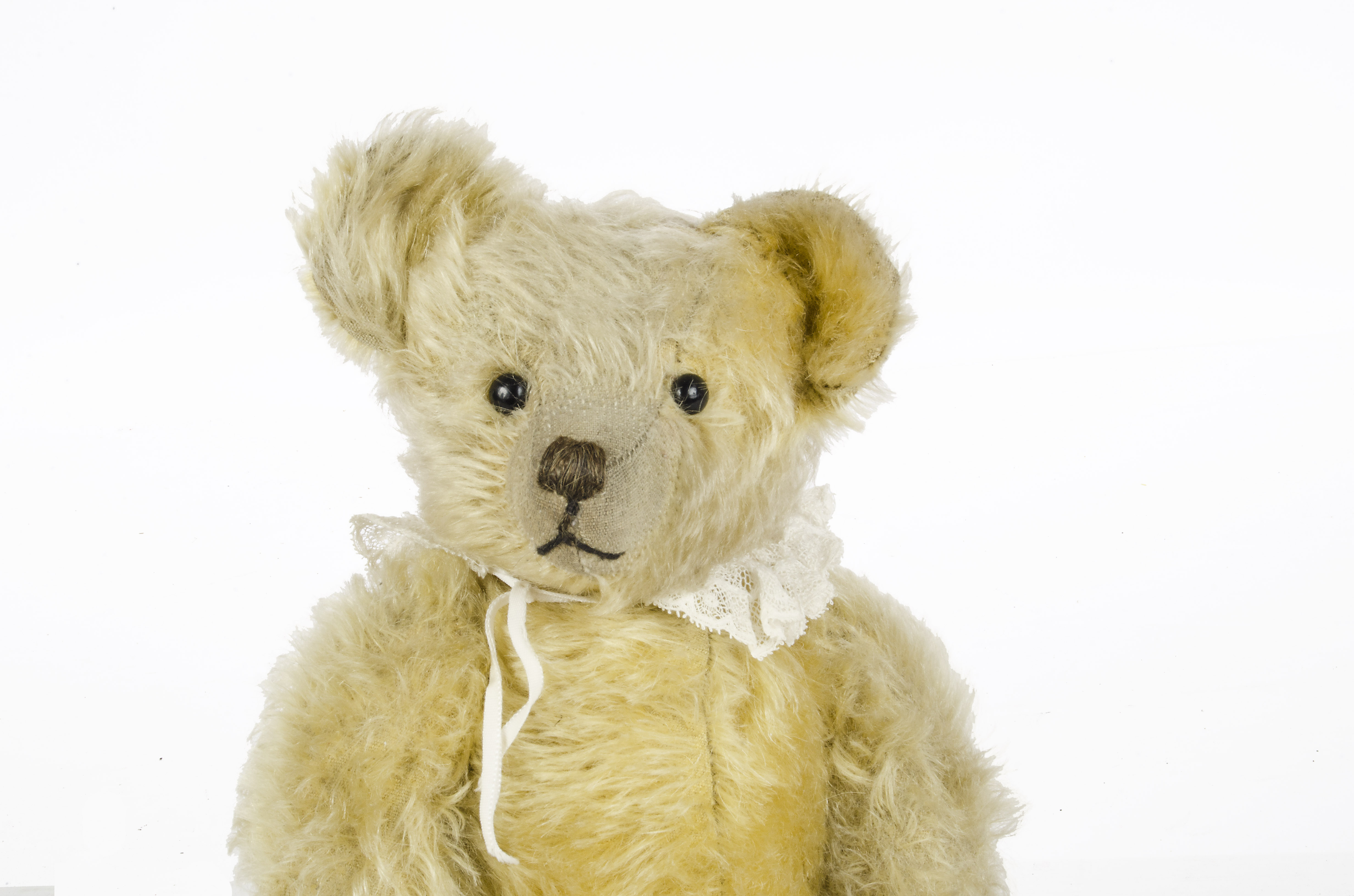 A early British Teddy Bear, 1920s, with pale golden mohair, black boot eyes, pronounced clipped - Image 2 of 2