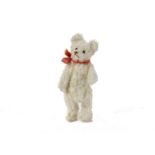 A rare Steiff miniature white mohair Teddy Bear, 1920s, with brown stitched nose and mouth, swivel