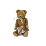 A German 1940s Teddy Bear with photograph, a brown artsilk bear with clear and black glass eyes with