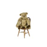 A small Steiff Teddy Bear, circa 1913, with pale golden mohair, black boot button eyes, pronounced