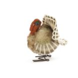 A Steiff Tucky Turkey, circa 1956, with mohair body, velvet head, felt wings and tail, metal feet,
