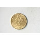1899 $10 Liberty. About Uncirculated. A very lustrous example with minimal wear and approaching
