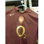 2005/06 Arsenal, a red/purple home shirt, as presented by the vendor by number 14, Thierry Henry.