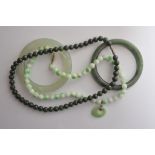 Two Jade and Nephrite bangles and beads