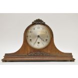 A large oak cased mantle clock with key