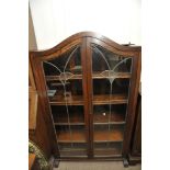 An oak book case with lead light doors