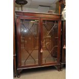 A mahogany reproduction display cabinet