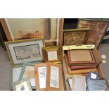 A box of various photo frames and pictur