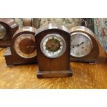 three oak cased mantel clocks