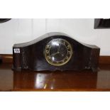 An oak mantel clock the dial with raised