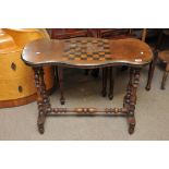 A Victorian stretcher base table inlaid