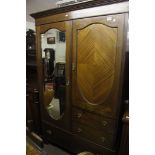 An Edwardian inlaid mahogany wardrobe fi