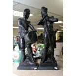 A pair of 20th Century bronze figures af