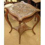 A carved occasional table