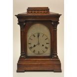 A Classical style oak cased mantle clock