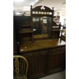 An Edwardian oak and ash chiffonier with